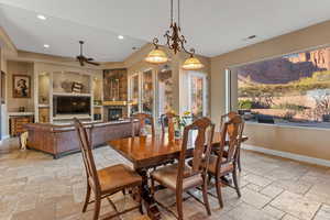 Dining area with stone tile floors, visible vents, baseboards, and recessed lighting