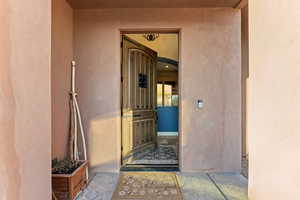 Property entrance with stucco siding