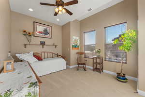 Bedroom with recessed lighting, baseboards, a ceiling fan, and light colored carpet