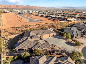 Birds eye view of property with a residential view and a mountain view