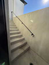 Staircase with concrete flooring