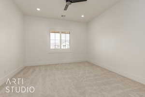 Empty room with light carpet, baseboards, visible vents, and recessed lighting