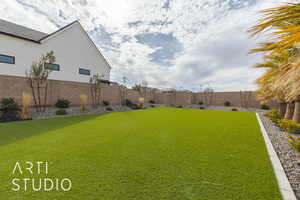 View of yard with a fenced backyard