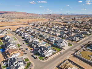 Birds eye view of property with a residential view and a mountain view