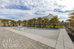 View of swimming pool with a fenced in pool, a fenced backyard, and a patio