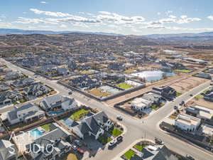 Drone / aerial view with a residential view and a water and mountain view