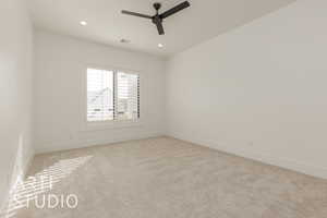 Unfurnished room with light carpet, visible vents, a ceiling fan, and recessed lighting