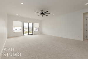 Unfurnished room with ceiling fan, baseboards, light colored carpet, and recessed lighting