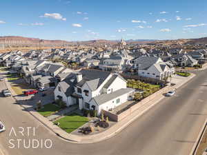 Birds eye view of property with a mountain view and a residential view