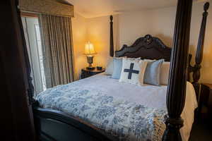 Bedroom featuring lofted ceiling
