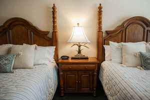 Bedroom featuring a textured wall