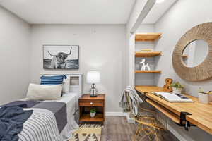 Bedroom featuring recessed lighting, LVP Flooring.  The closet is currently used as a desk but could be easily converted back