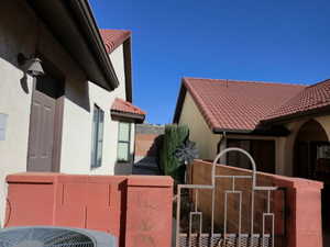 View of side of property with cooling unit