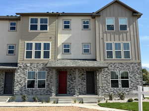 Townhome / multi-family property featuring board and batten siding