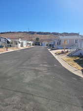 View of street with a residential view and curbs