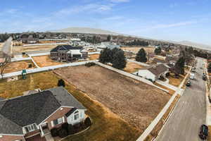 Birds eye view of property featuring a mountain view and a residential view