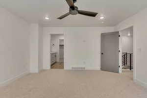 Unfurnished bedroom with recessed lighting, visible vents, light carpet, and baseboards