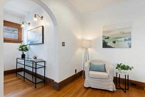 Arched entryway leading to living room