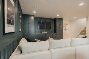 Cinema room with visible vents and recessed lighting