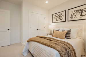 Bedroom featuring recessed lighting, baseboards, a closet, and light colored carpet