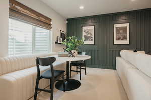 Dining space featuring recessed lighting and light colored carpet