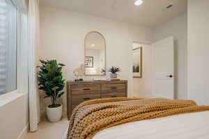 Bedroom featuring carpet, visible vents, baseboards, and recessed lighting