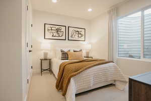 Bedroom featuring recessed lighting, light carpet, and baseboards