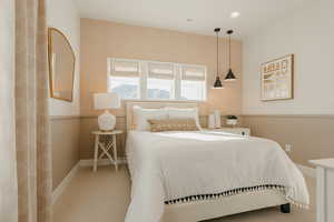 Carpeted bedroom with baseboards, visible vents, and wallpapered walls