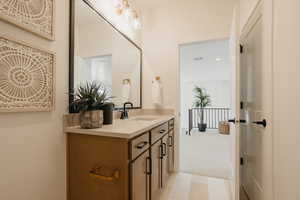 Bathroom featuring visible vents and vanity