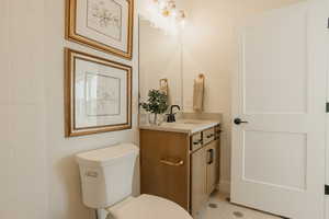 Half bath with vanity and toilet