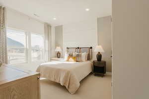 Bedroom featuring recessed lighting, visible vents, and light colored carpet