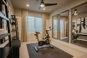 Workout area with visible vents, a healthy amount of sunlight, light colored carpet, and recessed lighting