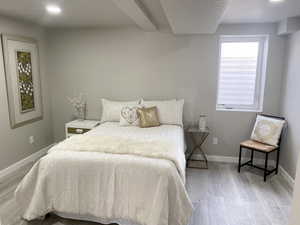 Bedroom featuring light wood-style flooring and baseboards