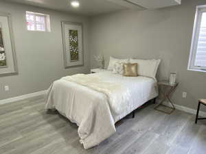 Bedroom featuring light wood-style floors and baseboards