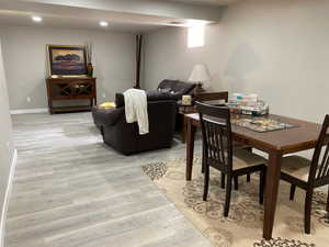 Dining room featuring light wood-style floors, recessed lighting, visible vents, and baseboards