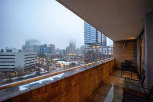 Balcony featuring a view of city