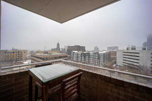 Balcony featuring a view of city