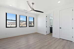 Unfurnished bedroom featuring recessed lighting, baseboards, and light wood finished floors