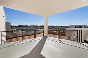 View of patio featuring a balcony