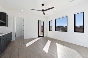 Unfurnished bedroom featuring light wood finished floors, recessed lighting, and baseboards