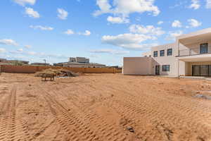 View of yard featuring fence