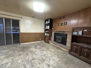 Living room with wainscoting and wooden walls