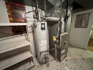 Utility room with water heater and heating unit