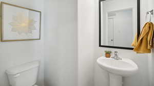 Bathroom featuring a sink and toilet