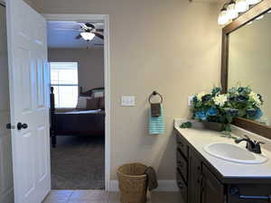 Bathroom featuring visible vents, connected bathroom, vanity, ceiling fan, and tile patterned flooring