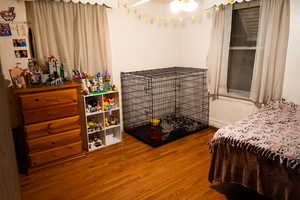 Bedroom featuring wood-type flooring