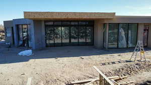 Property entrance featuring stucco siding