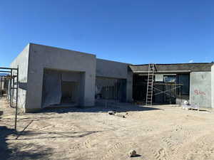 Exterior space featuring stucco siding