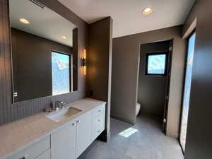 Bathroom with vanity and recessed lighting