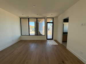 Empty room featuring wood finished floors and recessed lighting